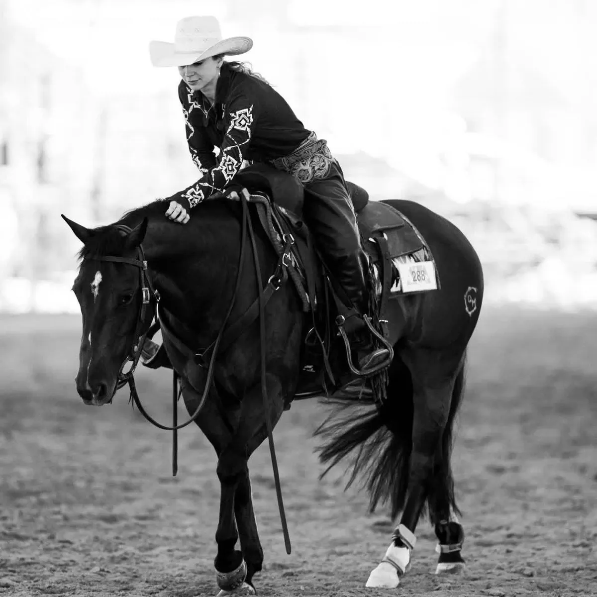 Black-and-white photograph of Arianna Picciotti on horseback at a competition