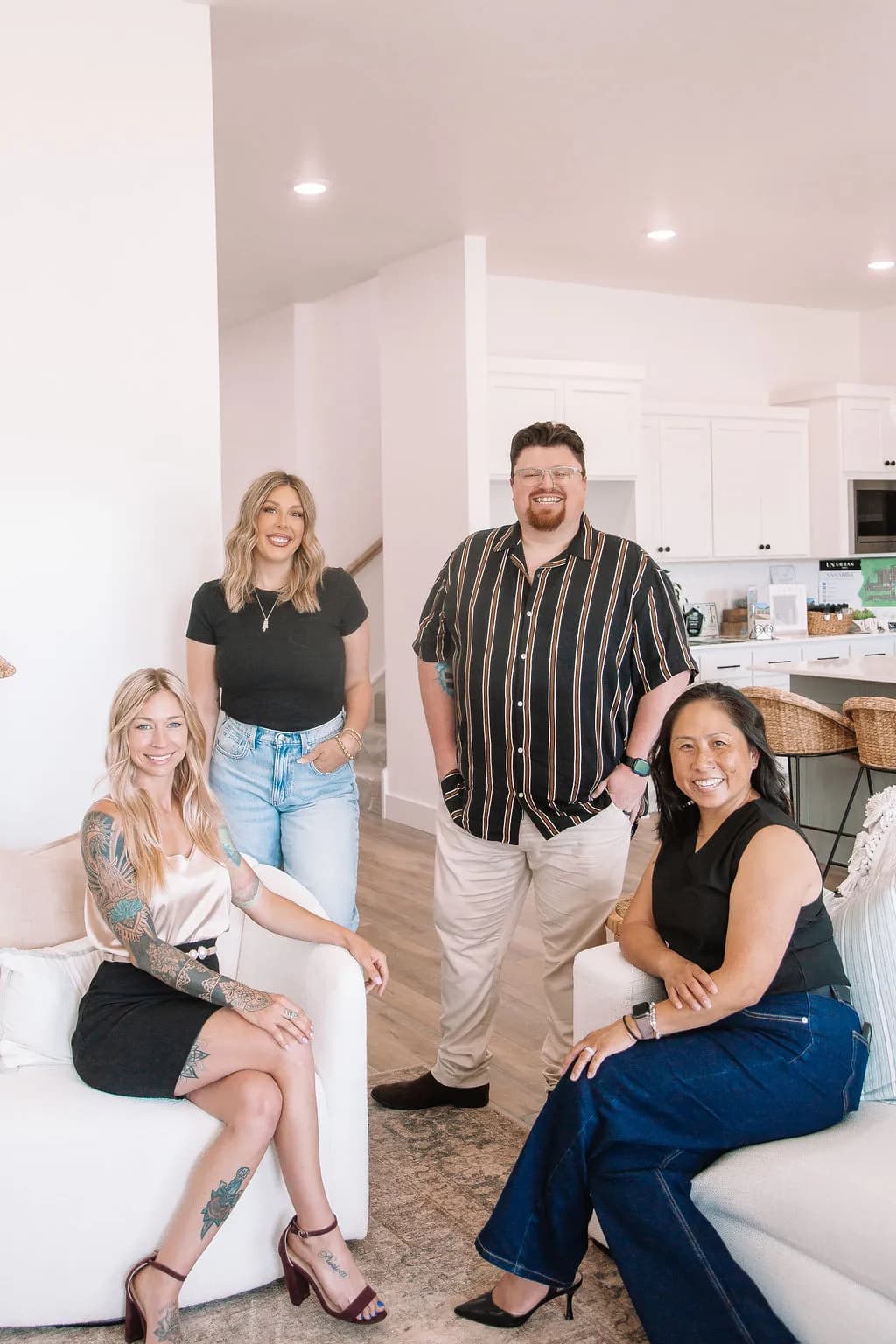 Arianna Picciotti with colleagues from SERV. Realty inside a home
